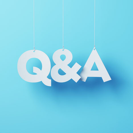 Q&A Letters hanging on a blue background