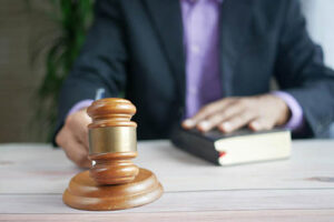 Man banging gavel on table