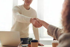 Shaking hands across a table