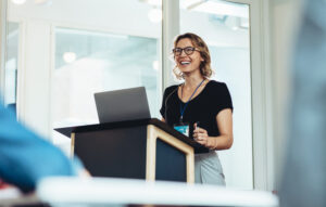 Successful female business professional addressing a seminar.