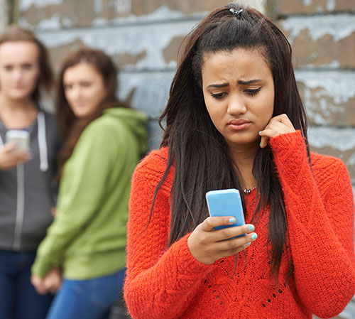 Teenage Girl Being Bullied By Text Message